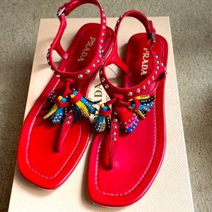 Red Prada tassel sandals